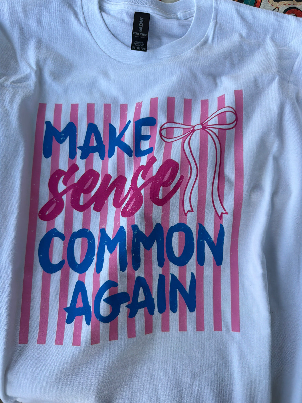 Make Sense Common Again graphic on women's t-shirt