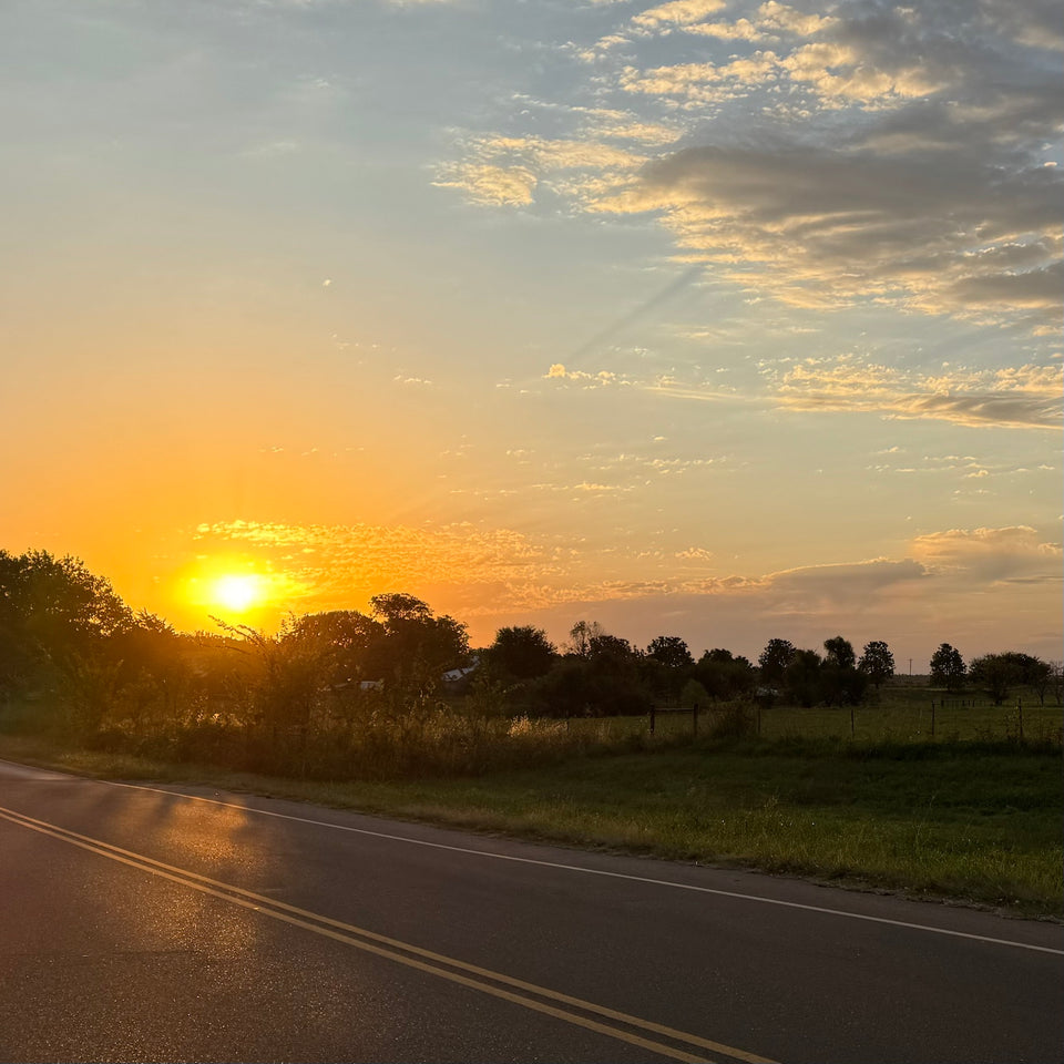 Sunset over a rural road near Jones