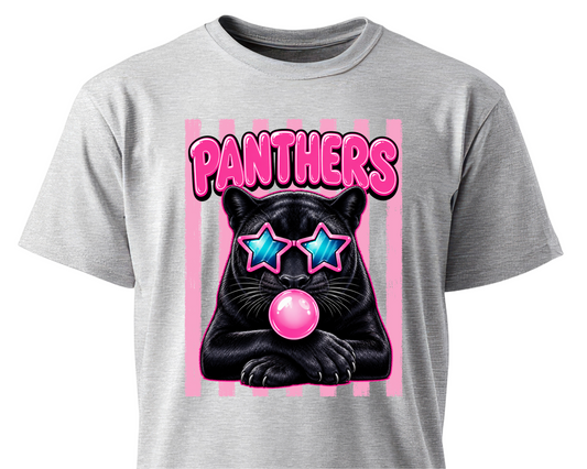 A heather gray short-sleeve t-shirt featuring a graphic print of a black panther wearing pink star-shaped sunglasses and blowing a pink bubblegum bubble, with the word 'PANTHERS' in pink above it.